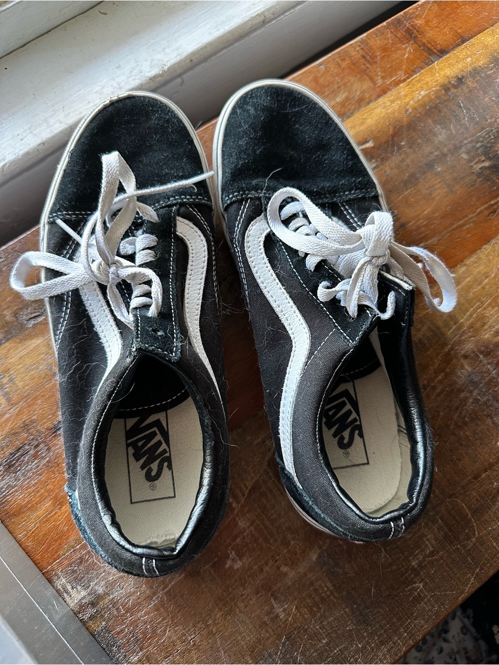 Vans women’s Black and White Low-Top Sneakers